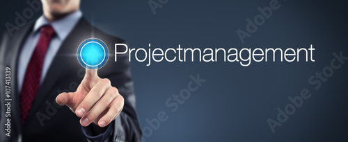 Man touching Button Projectmanagement photo