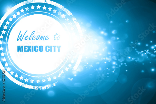 Blue stamp on a glittering background: Welcome to mexico city