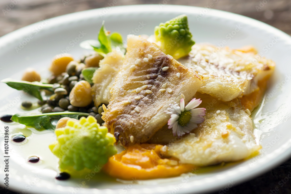Fish fillet with chickpeas, carrot puree and vegetables Fish fillet with chickpeas, carrot puree and vegetables
