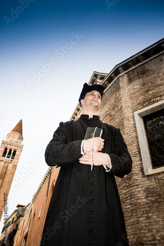 young priest in venice