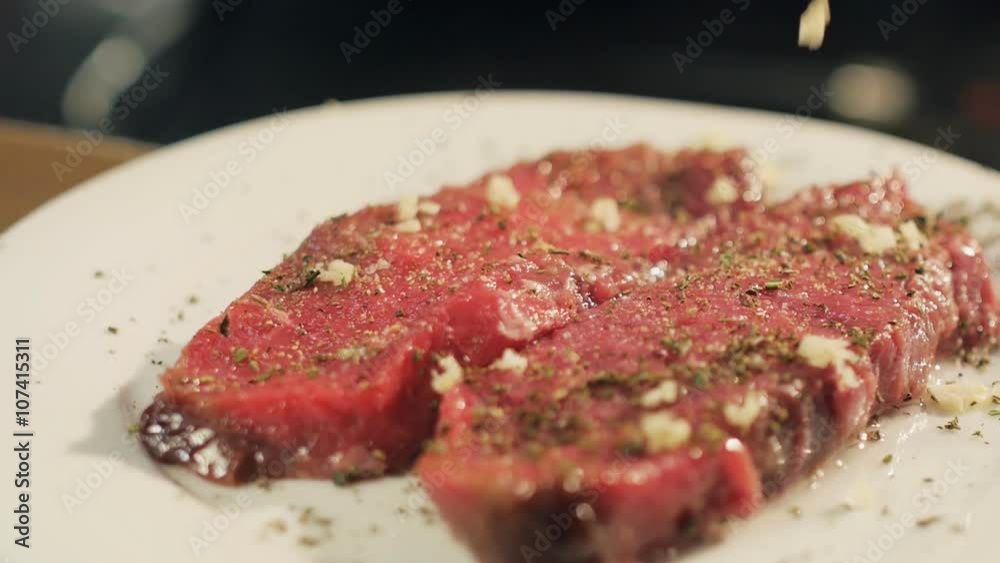 Cook rubbing veal steaks with chopped garlic Cook rubbing veal steaks with chopped garlic