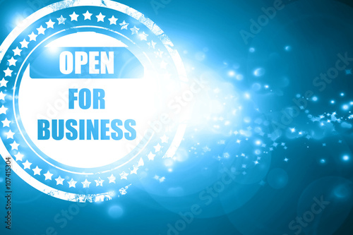 Blue stamp on a glittering background: Open for business sign