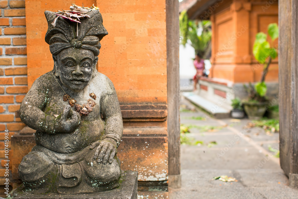 Traditional demon guard statue carved in stone on Bali, Indonesia. Traditional demon guard statue carved in stone on Bali, Indonesia.
