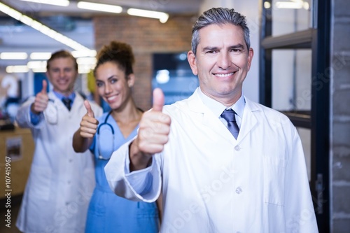 Medical team putting their thumbs up and smiling