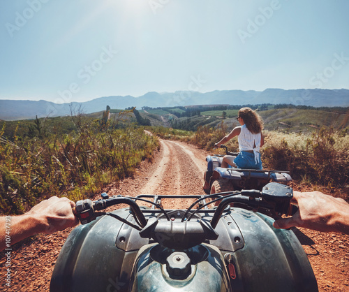 Young people on quad bikes on mountain trail © Jacob Lund