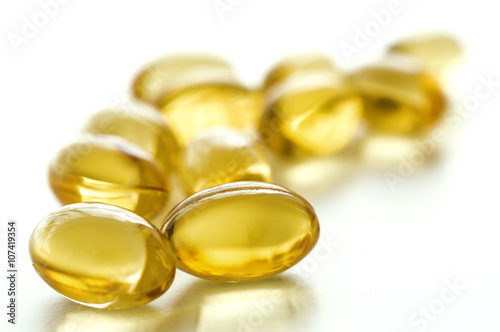 Fish oil capsules on white background