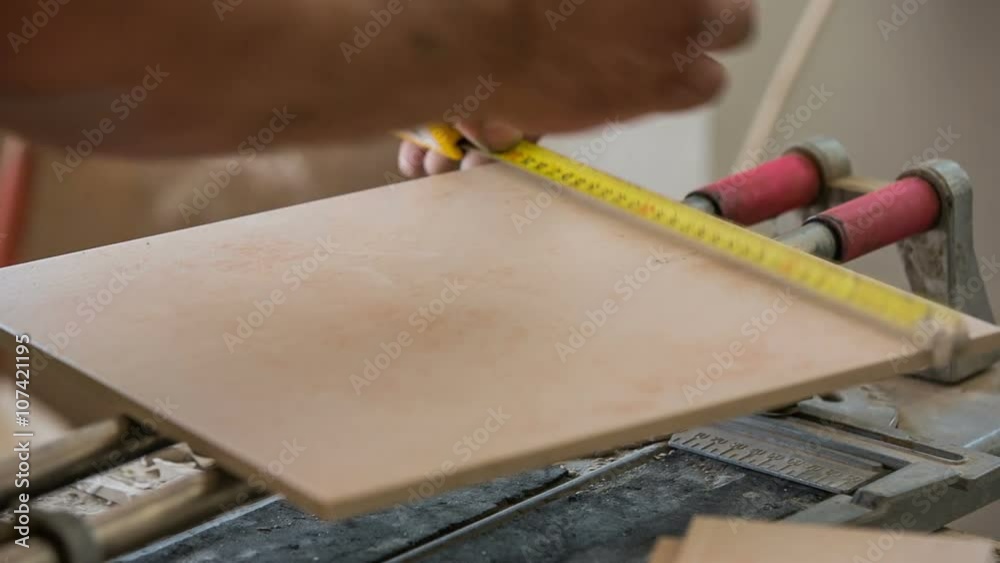 Marking a tile with pencil close up