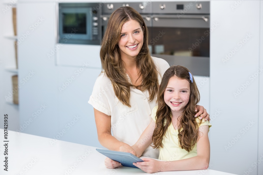 Portrait of mother and daughter with digital tablet Portrait of mother and daughter with digital tablet