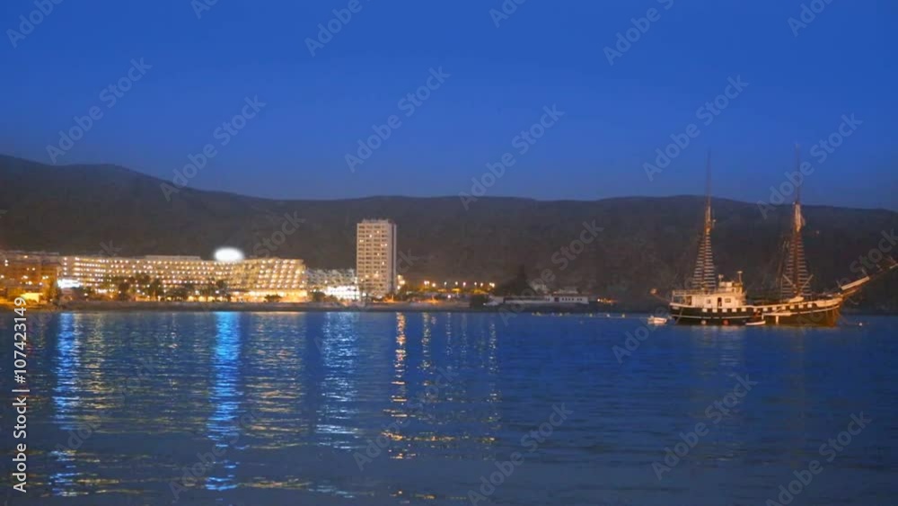 Los Cristianos beach at sunset in Arona Tenerife Canary Islands of Spain Los Cristianos beach at sunset in Arona Tenerife Canary Islands of Spain