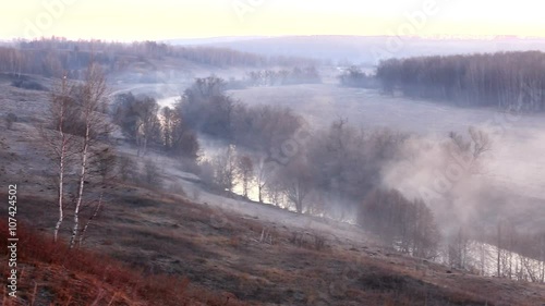 Dramatic sunrise with fog above Osetr river, Ryazan Region photo