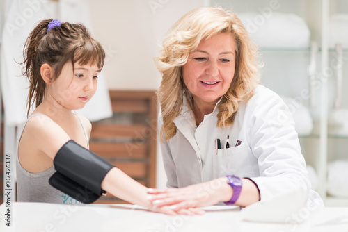 Pediatrician doing medical exam