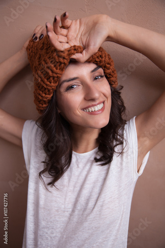 Happy smiling woman in knitted hat