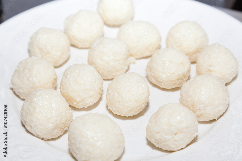 sweet Indian coconut burfi treats with selective focus