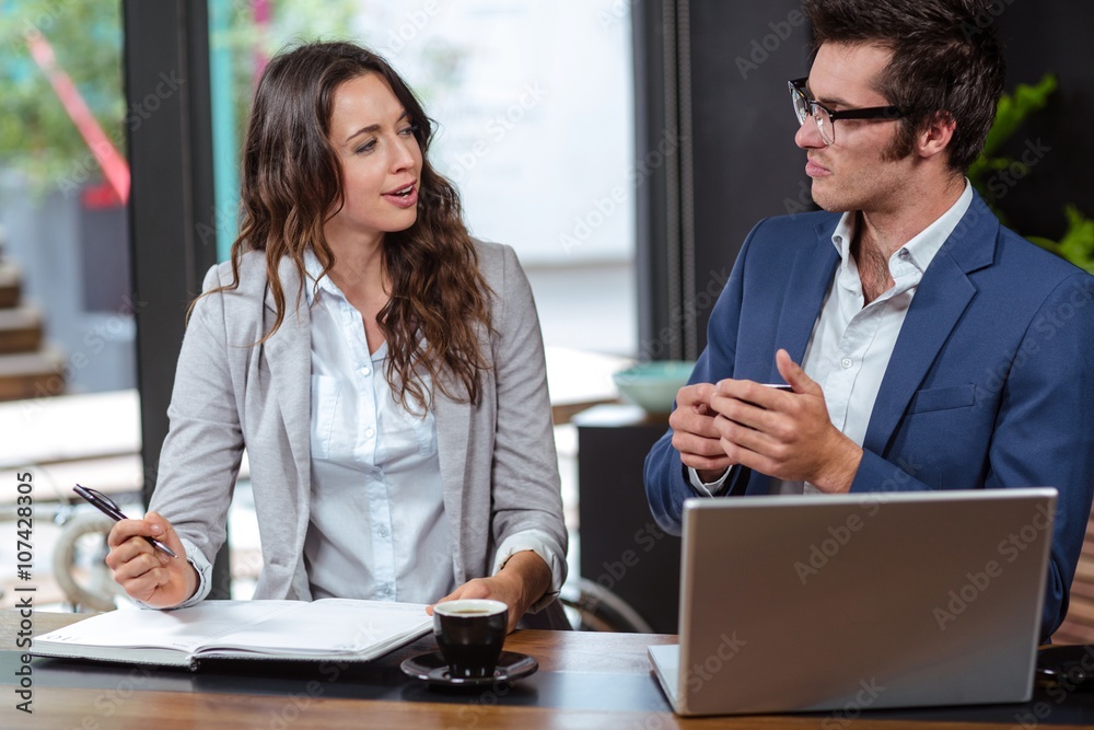 Obraz premium People writing in a notebook