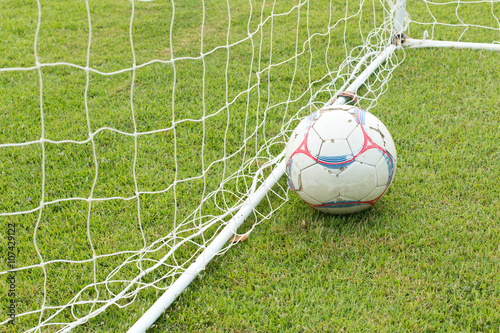 A view of a net on a vacant soccer pitch. © patboon