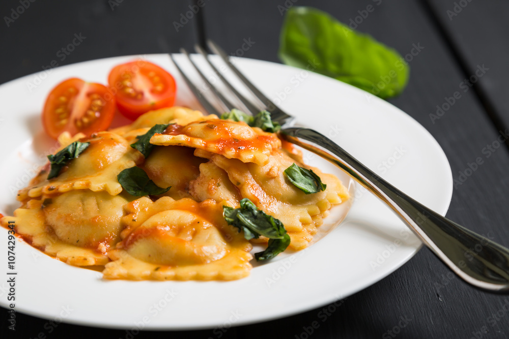 Ravioli with tomato sauce and basil