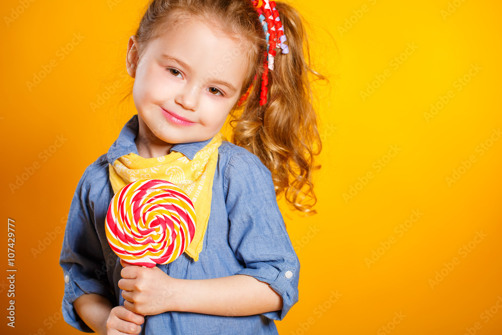 Studio portrait of a beautiful little girl with large Lollipop Studio portrait of a beautiful little girl with large Lollipop