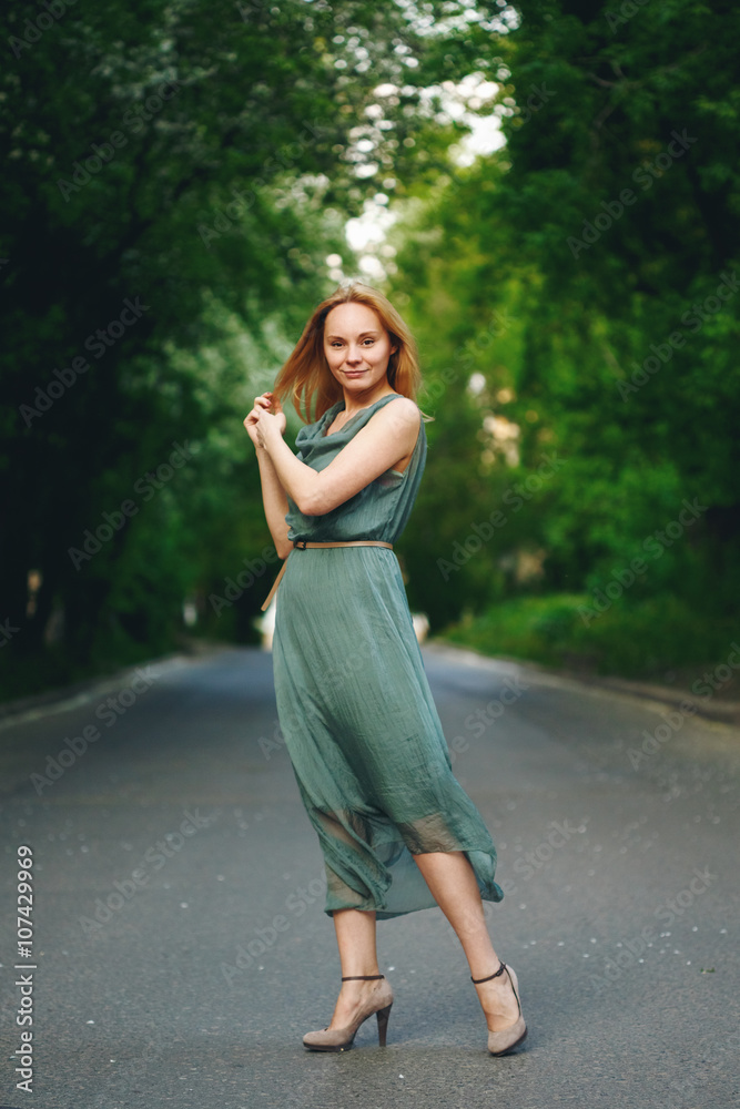 Young Woman Standing on the Road