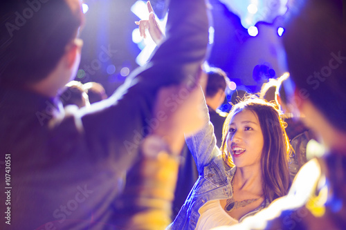 Happy young woman at music festival photo