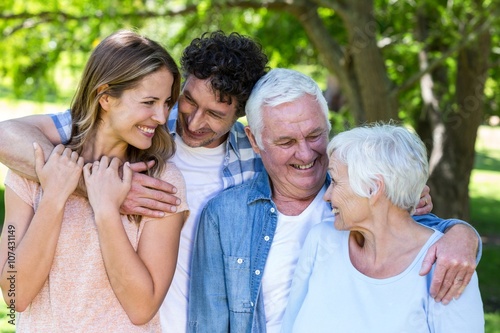 Smiling family hugging