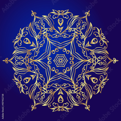 Mandala, amulet. Esoteric gold symbol on a blue background.