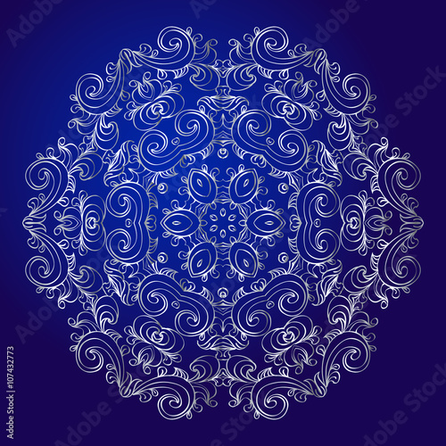 Mandala, amulet. Esoteric silver symbol on a blue background.