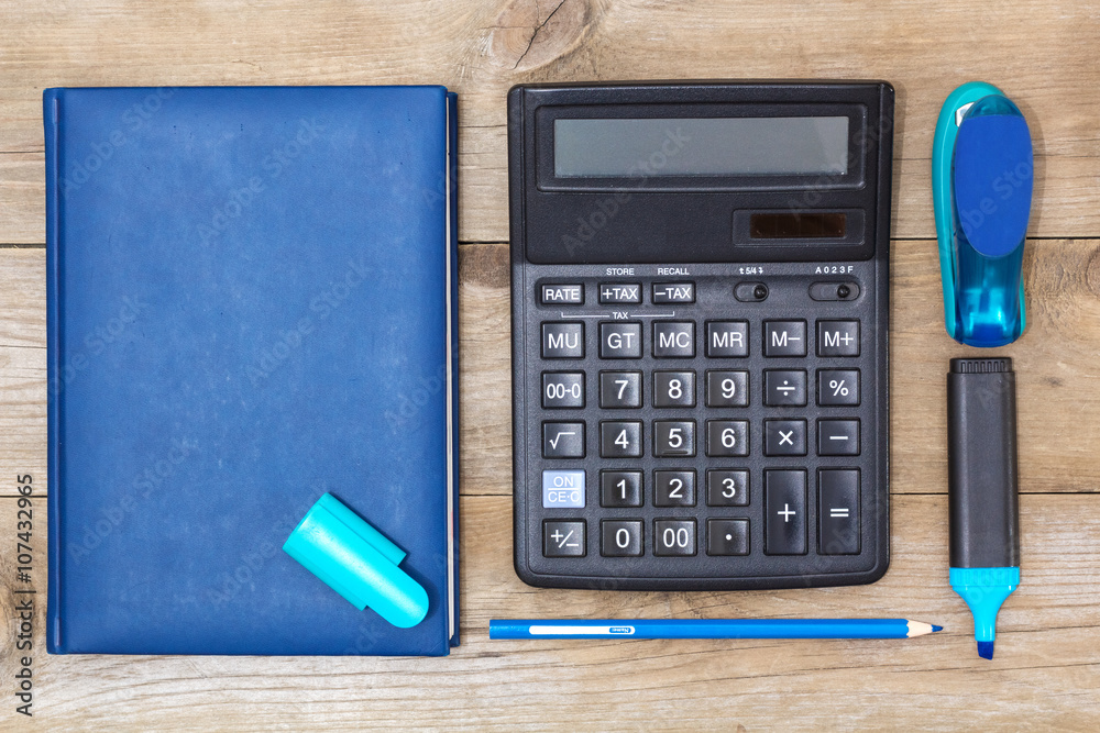 Office Set: diary, calculator, stapler and a marker Office Set: diary, calculator, stapler and a marker