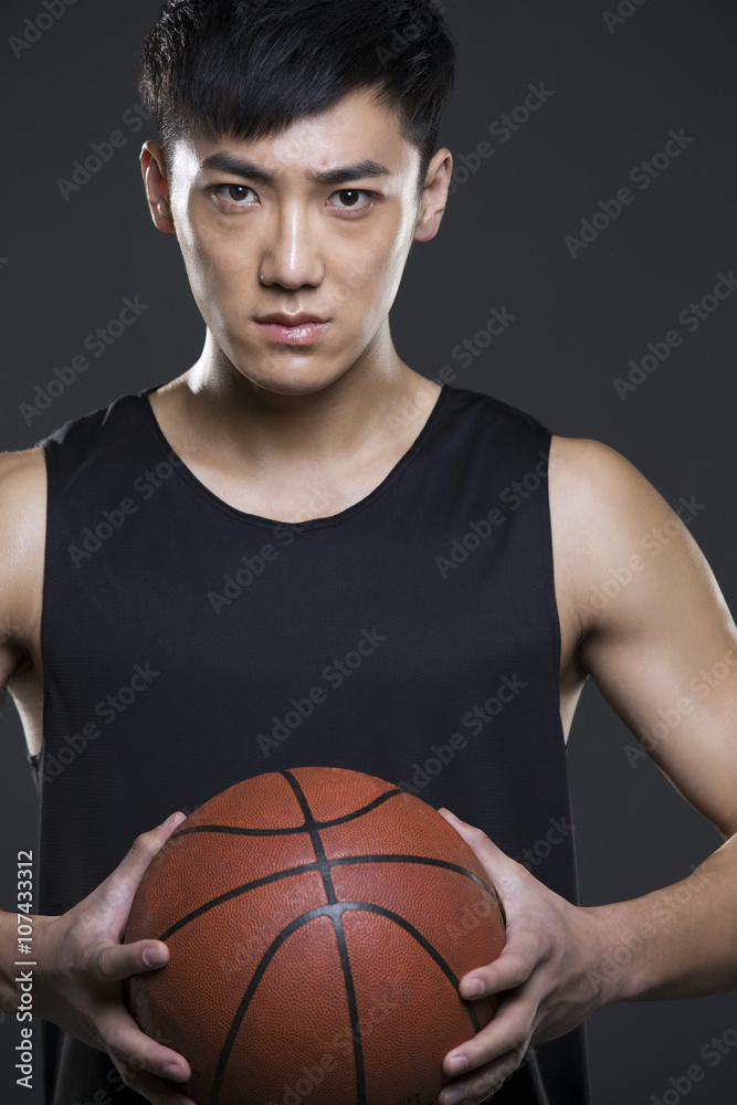 Young man holding a basketball