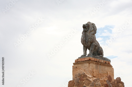  Bronze Lion and Mission San Xavier del Bac, which is a historic Spanish Catholic mission located about 10 miles south of downtown Tucson, Arizona,