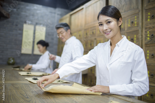 Chinese doctors in traditional Chinese medicine pharmacy