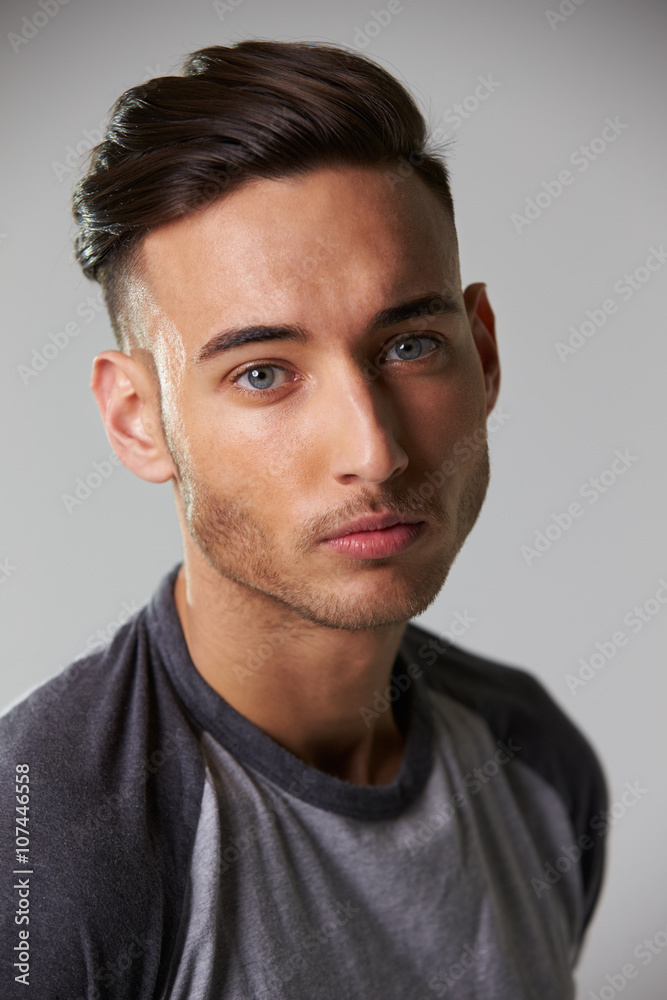 Vertical head and shoulders portrait of smiling young man Vertical head and shoulders portrait of smiling young man