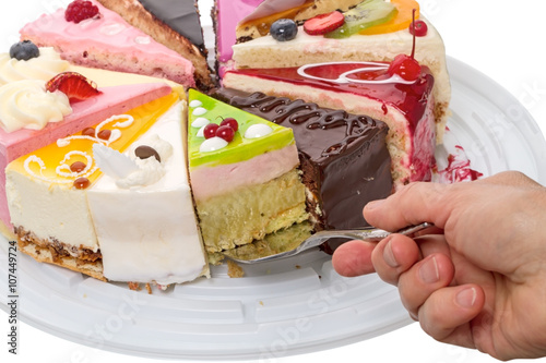 Hand takes a piece of cake