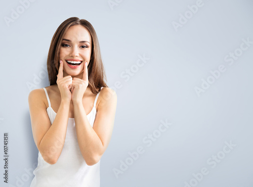 young woman showing smile, with copyspace