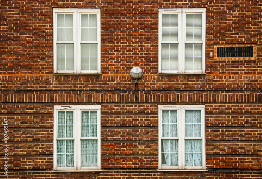 London, a traditional red bricks building with windows