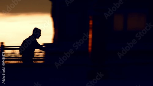 two young guys are skating on sunset silhouette  BMCC photo