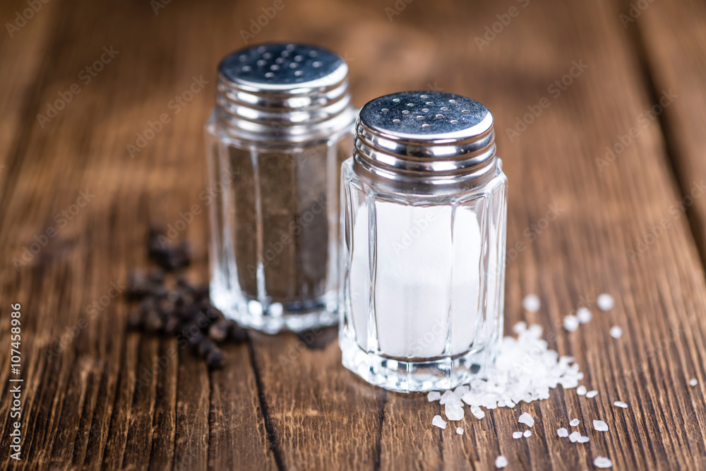Salt and Pepper Shaker on wooden background