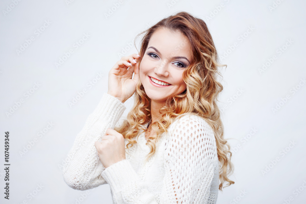 Woman in warm sweater, portrait on white background Woman in warm sweater, portrait on white background