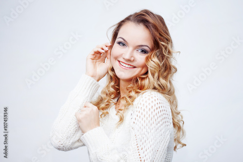 Woman in warm sweater, portrait on white background