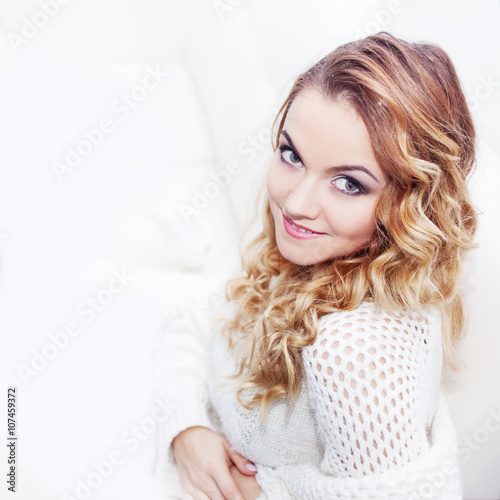Woman in warm sweater, portrait on white background, place for your text