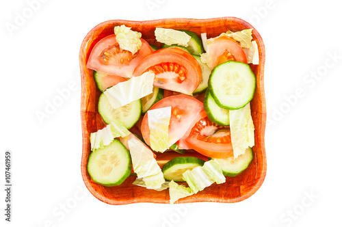 Vegetable salad in bowl on white background. Top view