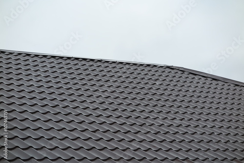 Modern roof covered with tile effect PVC coated metal roof sheets