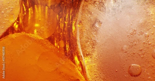 Ice cubes floating in liquid. 