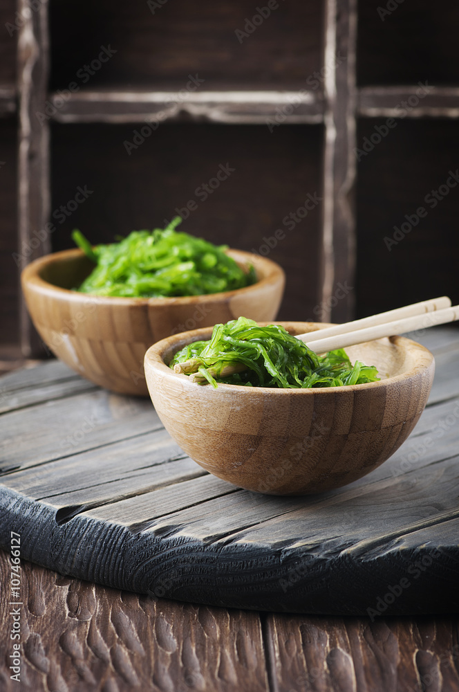 Traditional Japanese salad chuka on the wooden table Traditional Japanese salad chuka on the wooden table