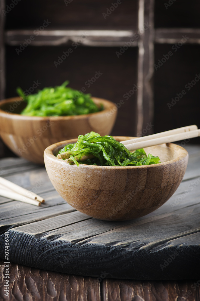 Japanese chuka salad on the wooden table Japanese chuka salad on the wooden table