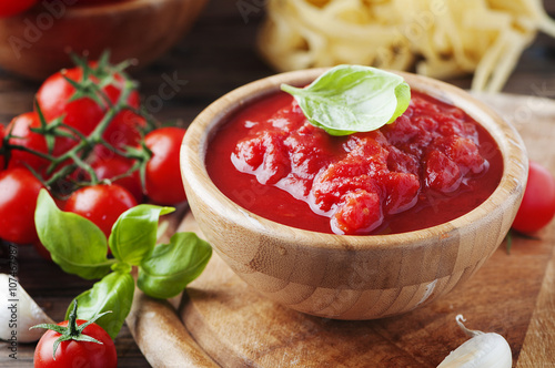 Italian homemade sauce with tomato and basil photo