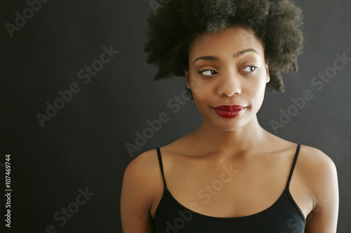 Close up of black woman smirking