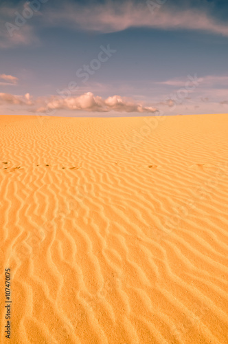 Desert sands and sunset clouds