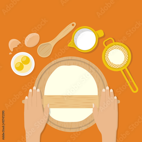 Woman's hands knead dough on table