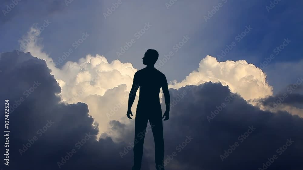 The man stand against the background of volume cloud. Time lapse. Wide angle