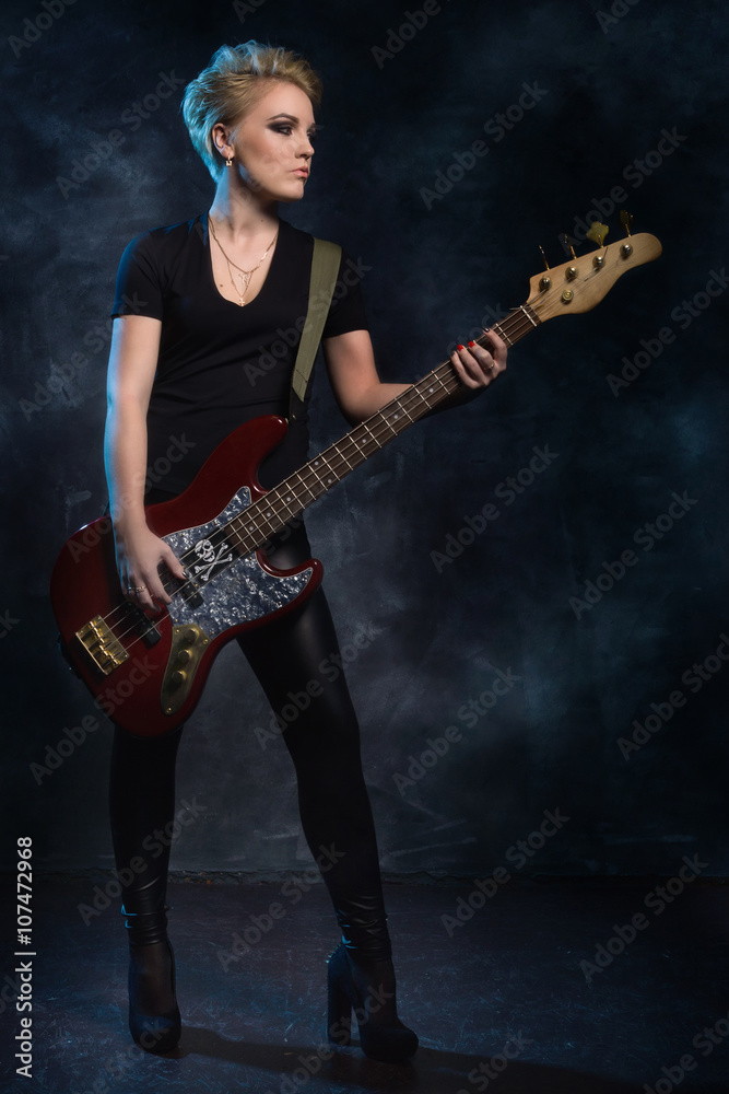 Rock star playing bass guitar
